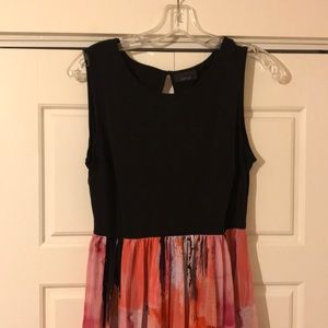 A dress with black top and multicolored bottom
